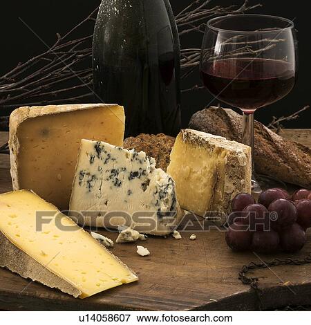 "Still life with cheese and red wine on wooden table, studio shot" View Large Photo Image Stock Photo - "Still life with cheese and red wine on wooden table, studio shot". Fotosearch