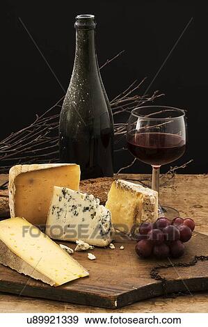 "Still life with cheese and red wine on wooden table, studio shot" View Large Photo Image Stock Photo - "Still life with cheese and red wine on wooden table, studio shot". Fotosearch