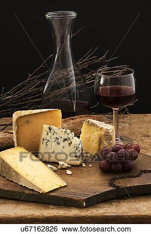"Still life with cheese and red wine on wooden table, studio shot" View Large Photo Image Stock Photograph - "Still life with cheese and red wine on wooden table, studio shot". Fotosearch