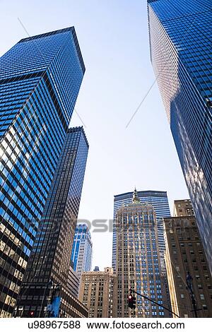 View of skyscrapers and clear sky View Large Photo Image Stock Photo - View of skyscrapers and clear sky. Fotosearch