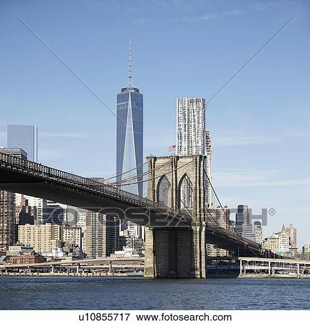 Stock Photo - View of suspension bridge and cityscape. Fotosearch