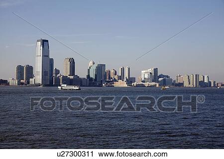 Stock Image - View of waterfront cityscape. Fotosearch