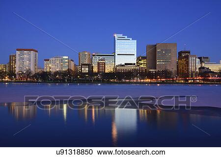Stock Image - "Waterfront at dusk, reflection in water". Fotosearch