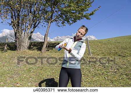 Stock Image - Woman applying suntan lotion . Fotosearch