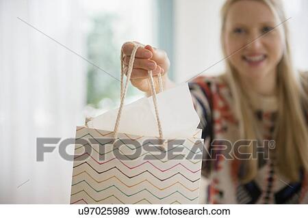 Woman giving gift View Large Photo Image Stock Photo - Woman giving gift. Fotosearch