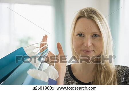 Woman holding shopping bags View Large Photo Image Stock Photography - Woman holding shopping bags. Fotosearch