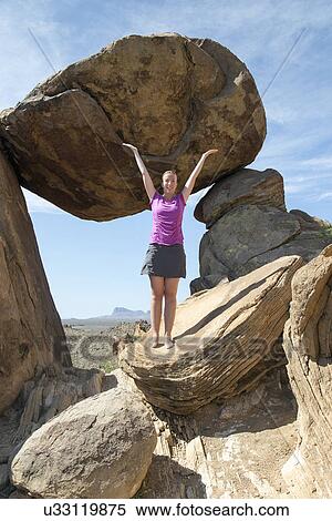 Stock Photography - Woman visiting Balanced Rock . Fotosearch