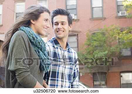 Stock Image - Young couple talking . Fotosearch