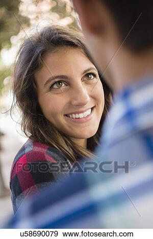 Young people flirting View Large Photo Image Stock Photo - Young people flirting. Fotosearch