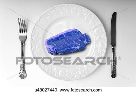 Stock Image - Blue meat on white plate. Fotosearch