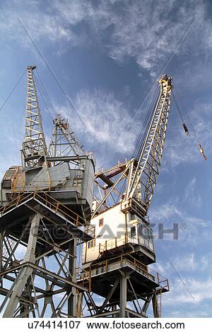 Cranes at Victoria and Albert docks View Large Photo Image Stock Photo - Cranes at Victoria and Albert docks. Fotosearch
