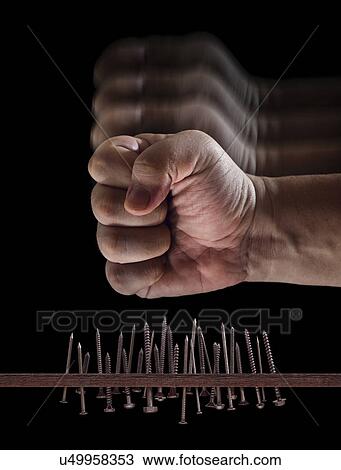 Fist hitting nails and screws View Large Illustration Drawing - Fist hitting nails and screws. Fotosearch