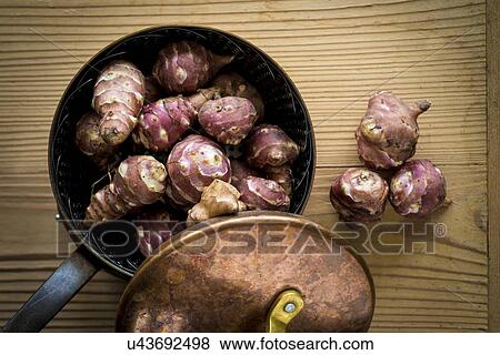 Stock Photo - Jerusalem artichokes in saucepan. Fotosearch