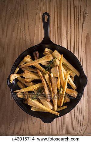 Parsnips in frying pan View Large Photo Image Picture - Parsnips in frying pan. Fotosearch