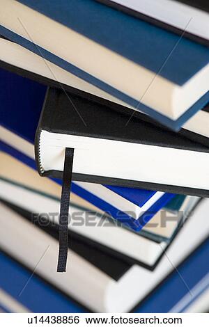 Stock Photograph - Pile of hardback books. Fotosearch