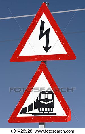 Railway crossing and electricity signs View Large Photo Image Stock Photo - Railway crossing and electricity signs. Fotosearch