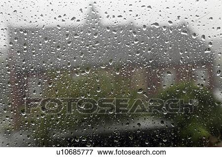 Rain drops on window View Large Photo Image Stock Photo - Rain drops on window. Fotosearch