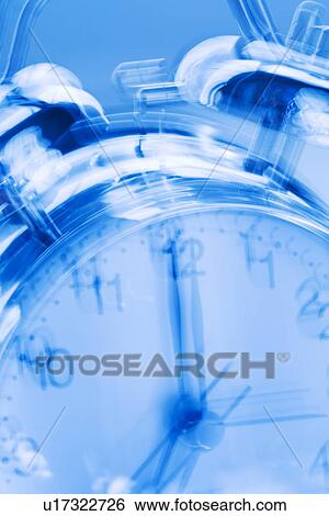 Stock Photograph - Ringing alarm clock. Fotosearch