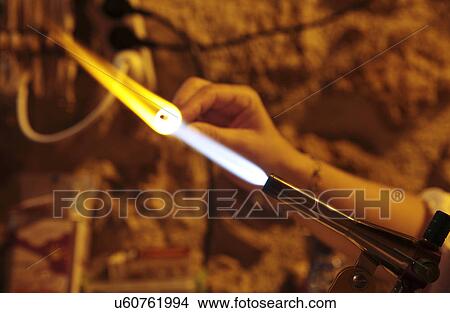 Woman making glass jewellery View Large Photo Image Picture - Woman making glass jewellery. Fotosearch