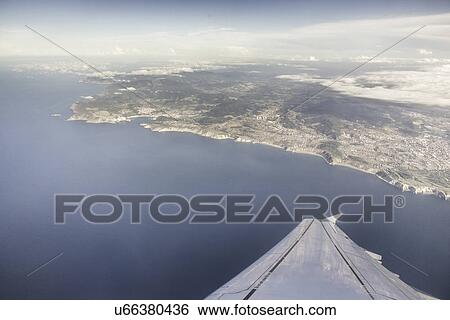 "Aerial view of coastline and airplane wing, Bilbao, Spain" View Large Photo Image Stock Photograph - "Aerial view of coastline and airplane wing, Bilbao, Spain". Fotosearch