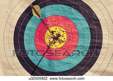 Archery target with arrow in the centre View Large Photo Image Stock Image - Archery target with arrow in the centre. Fotosearch