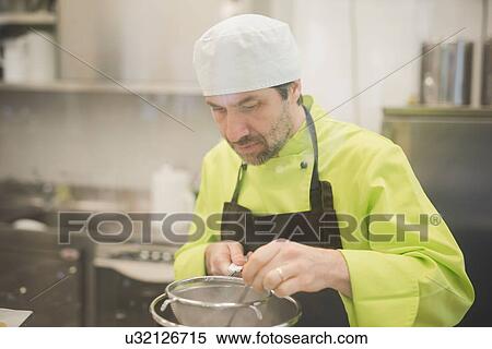 Baker cooking in kitchen View Large Photo Image Stock Photography - Baker cooking in kitchen. Fotosearch