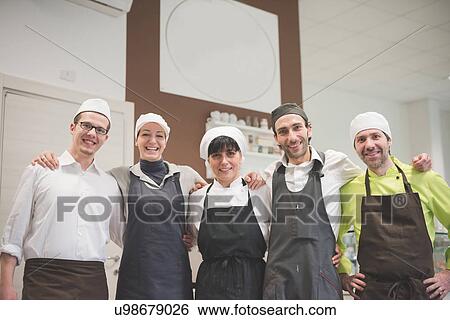 Bakers and waiters at cafe View Large Photo Image Stock Photograph - Bakers and waiters at cafe. Fotosearch