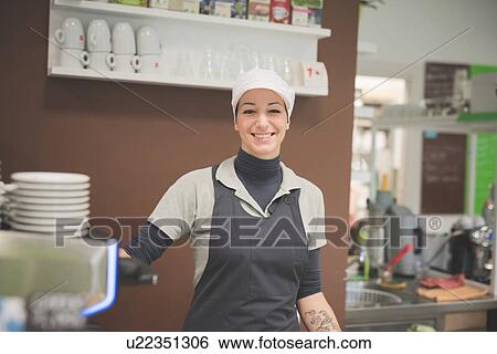 Stock Photograph - Barista working at cafe. Fotosearch
