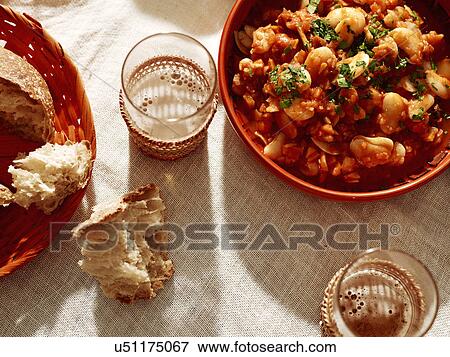 Bowl of white bean stew with bread and beer View Large Photo Image Stock Photo - Bowl of white bean stew with bread and beer. Fotosearch