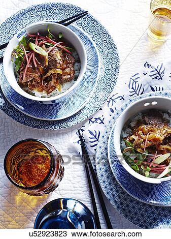 Bowls of curry with steamed rice and Japanese umeboshi vinegar View Large Photo Image Stock Image - Bowls of curry with steamed rice and Japanese umeboshi vinegar. Fotosearch