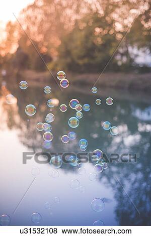 Bubbles floating View Large Photo Image Stock Photo - Bubbles floating. Fotosearch