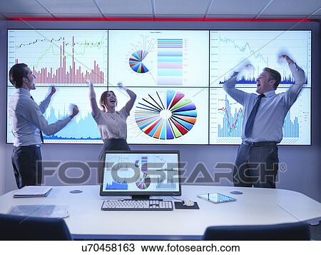 Business people celebrating success in front of graphs on screen View Large Photo Image Stock Image - Business people celebrating success in front of graphs on screen. Fotosearch