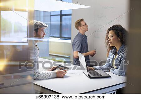Business team discussing ideas at meeting View Large Photo Image Stock Photo - Business team discussing ideas at meeting. Fotosearch