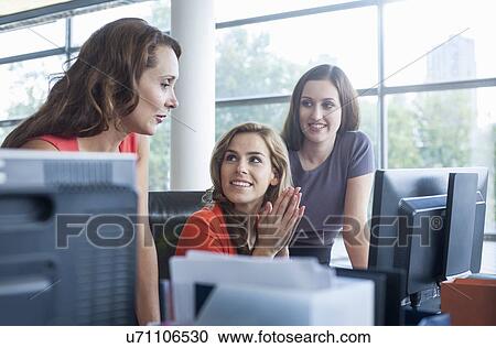 Businesswoman presenting ideas at office desk meeting View Large Photo Image Stock Image - Businesswoman presenting ideas at office desk meeting. Fotosearch