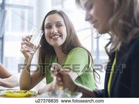 Businesswomen enjoying lunch View Large Photo Image Stock Photography - Businesswomen enjoying lunch. Fotosearch
