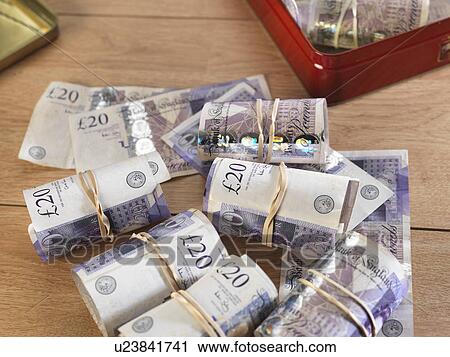 Cash savings in biscuit tin View Large Photo Image Stock Image - Cash savings in biscuit tin. Fotosearch