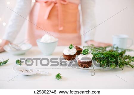 Chocolate cupcakes topped with whipped cream View Large Photo Image Stock Photograph - Chocolate cupcakes topped with whipped cream. Fotosearch
