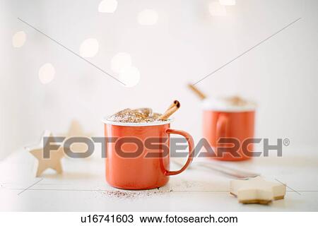 "Chocolate milk topped with whipped cream, cocoa powder & cinnamon stick" View Large Photo Image Stock Image - "Chocolate milk topped with whipped cream, cocoa powder & cinnamon stick". Fotosearch