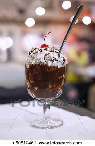 Chocolate sundae with cherry on top View Large Photo Image Stock Image - Chocolate sundae with cherry on top. Fotosearch
