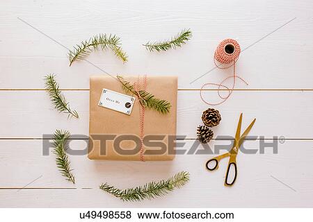 Stock Photo - "Christmas gift, thread, scissors, pine cone, pine needles". Fotosearch