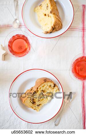 Stock Image - Christmas panettone with rose sparkling wine. Fotosearch