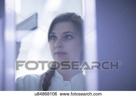 Close up of female scientist examining microscopy slide View Large Photo Image Stock Photograph - Close up of female scientist examining microscopy slide. Fotosearch