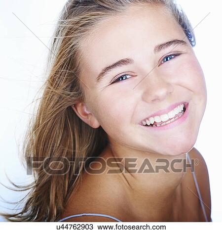 Stock Image - Close up of smiling teenage girl. Fotosearch