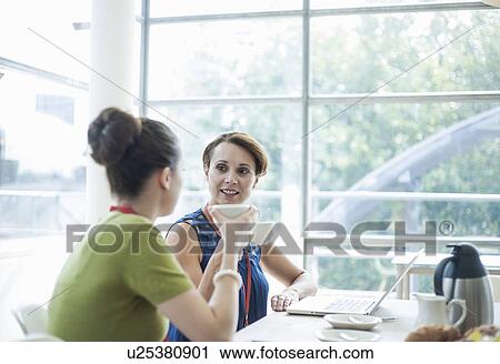 Colleagues having breakfast meeting View Large Photo Image Stock Image - Colleagues having breakfast meeting. Fotosearch