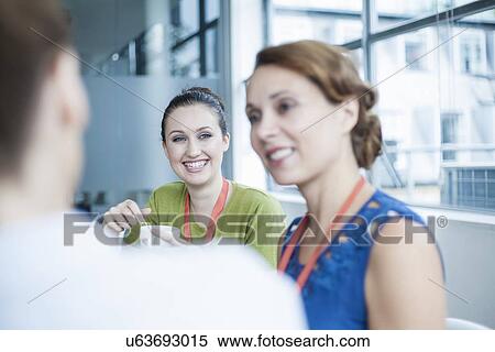 Stock Photography - Colleagues having coffee break. Fotosearch