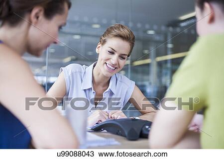 Colleagues on conference call View Large Photo Image Stock Image - Colleagues on conference call. Fotosearch