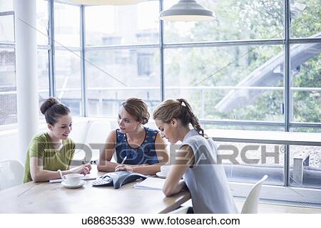 Colleagues on conference call View Large Photo Image Stock Photo - Colleagues on conference call. Fotosearch