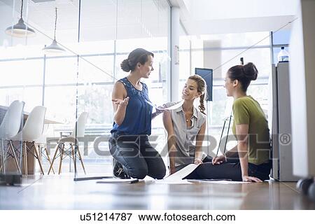 Colleagues preparing and brainstorming for presentation View Large Photo Image Stock Photo - Colleagues preparing and brainstorming for presentation. Fotosearch