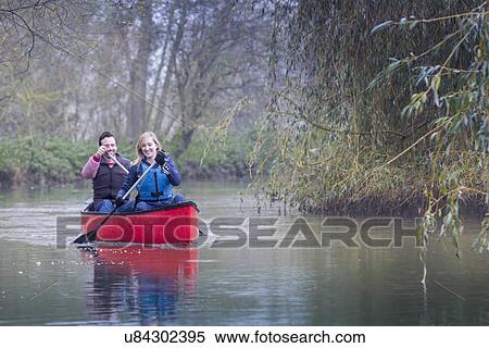 Stock Photography - Couple canoeing. Fotosearch
