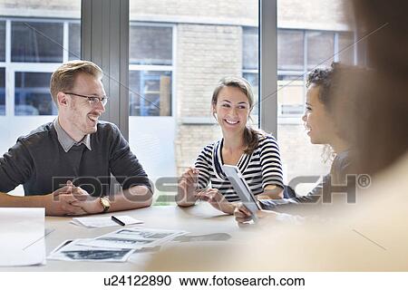 Design team meeting at conference table in creative office View Large Photo Image Stock Image - Design team meeting at conference table in creative office. Fotosearch